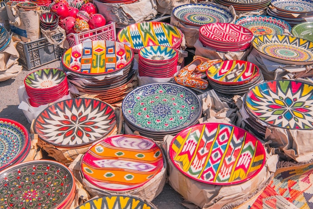 Colorful plates and pots at Chorsu bazaar Tashkent Uzbekistan Background image colorful souvenirs