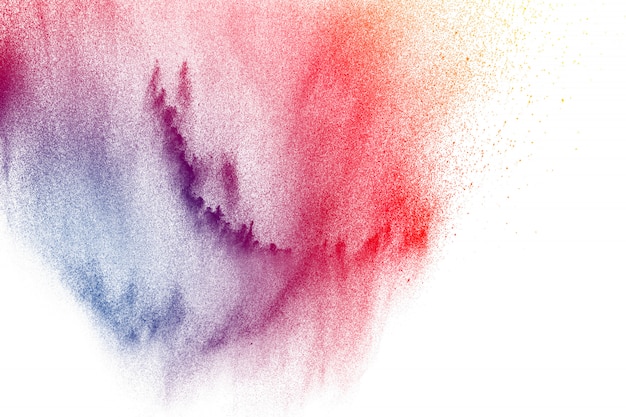 Colorful powder explosion on white background. abstract pastel color dust particles splash.