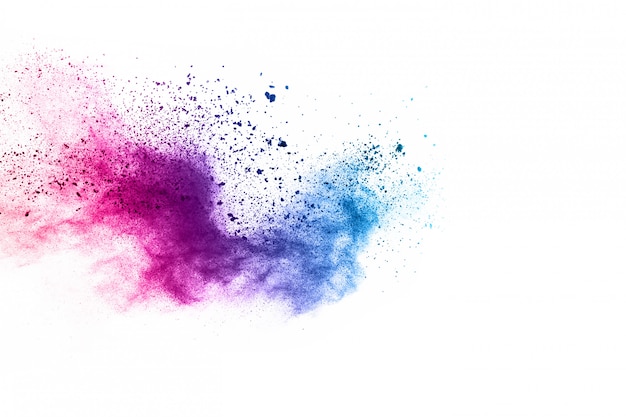 Photo colorful powder explosion on white background.