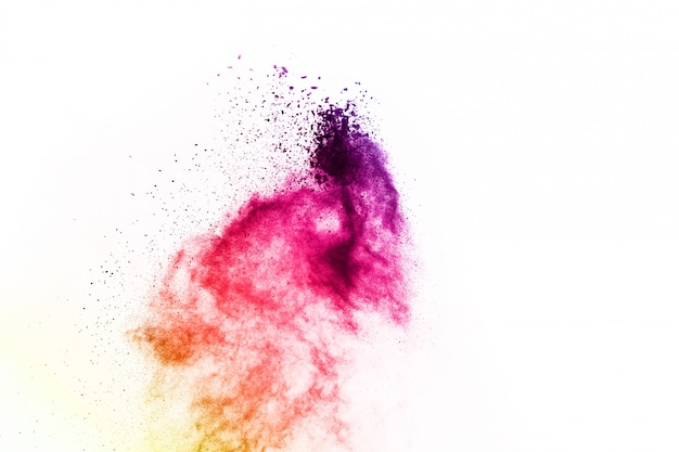 Colorful powder explosion on white background.   