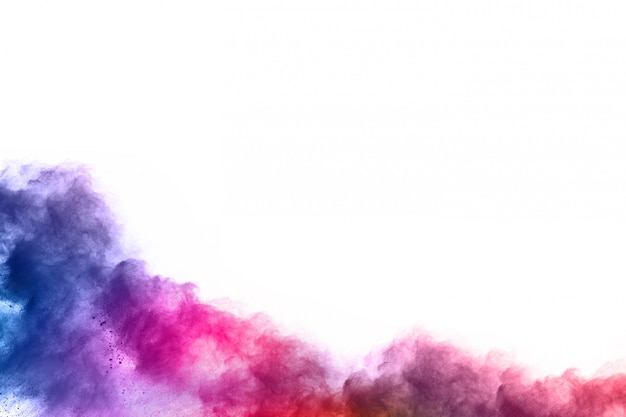 Photo colorful powder explosion on white background.