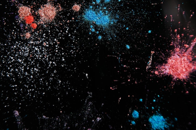 Colorful powdery splashes top view