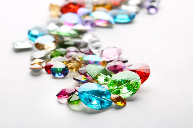 Colorful precious stones for jewellery on white background