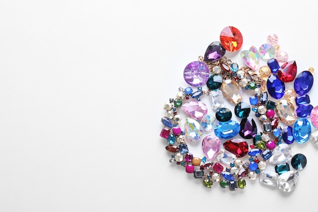 Colorful precious stones for jewellery on white background