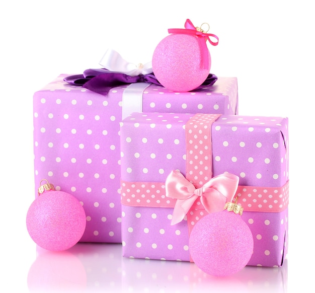 Colorful purple in peas gifts with pink Christmas balls isolated on white