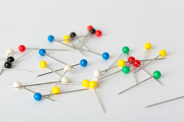 Colorful pushpins on a white board