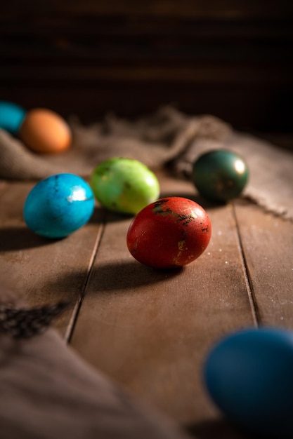 Colorful rainbow Easter eggs on a wooden background