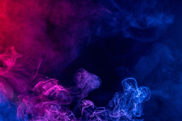 Photo colorful red and blue color smoke isolated on black background