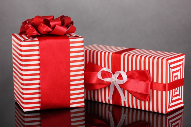 Colorful red gifts on grey background