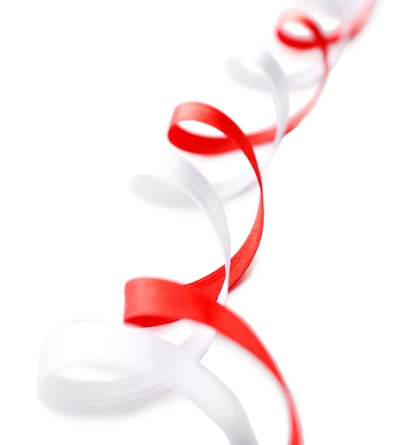 Colorful red and white ribbons isolated on white