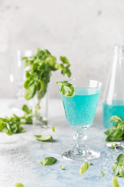 Colorful refreshing summer drink with basil
