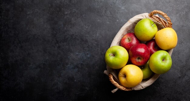 Colorful ripe apple fruits in basket