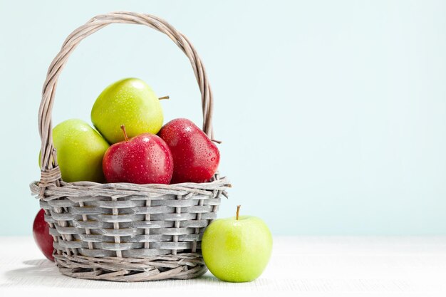 Colorful ripe apple fruits in basket