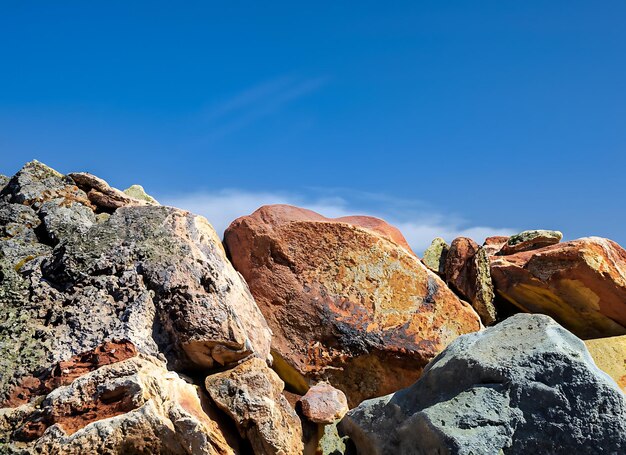 A colorful rocks in front of a blue sky