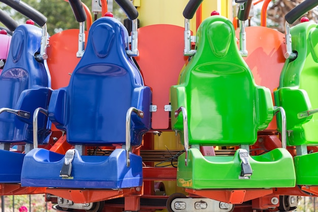 Colorful roller coaster seats at amusement park in Thailand