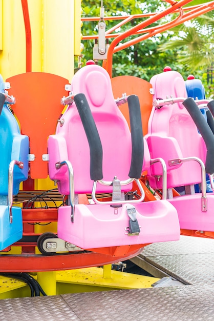 Colorful roller coaster seats at amusement park 