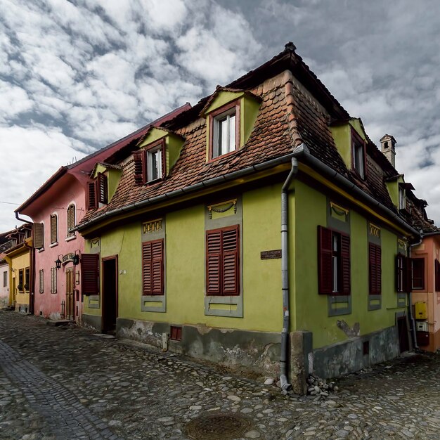 colorful Romanian village under angry sky