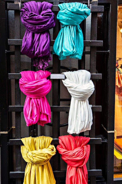 Colorful scarfs showcase next to the shop entrance in the city of Stockholm, Sweden