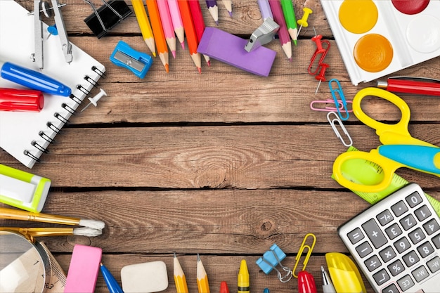 Colorful school supplies on  background