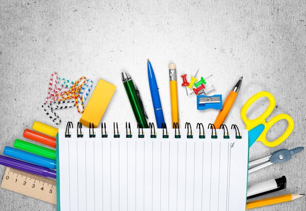 Photo colorful school supplies on  background