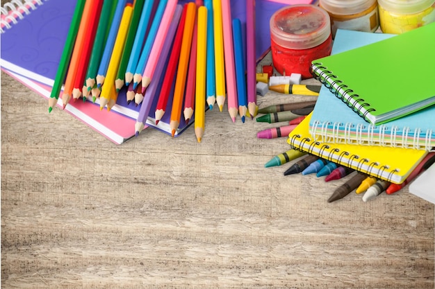 Colorful school supplies on   background