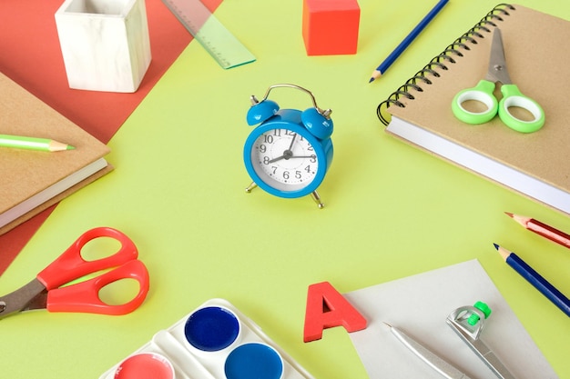 Colorful school supplies light green background Items Back to school accessories Lime copy space