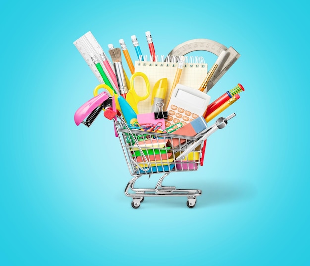 Colorful school supplies in shopping cart