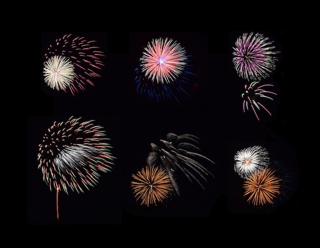 Colorful sets of fireworks exploding in the black night sky