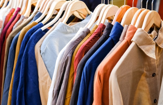 Colorful shirts on the hangers in the store