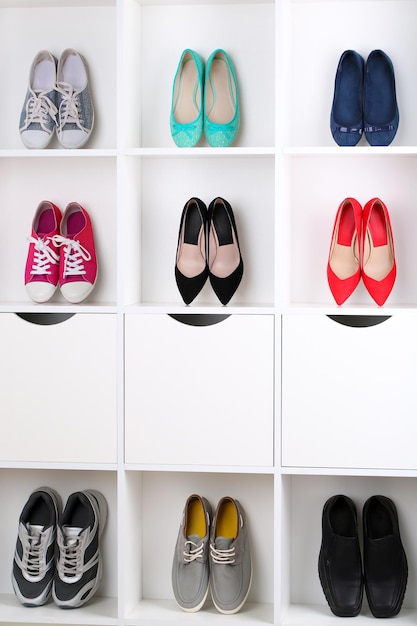 Colorful shoes on wooden shelves