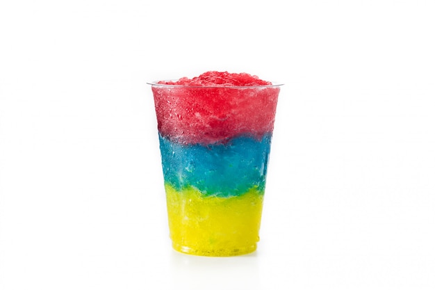 Colorful slushie of differents flavors with straw in plastic cup