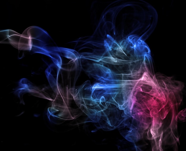 Photo colorful smoke on the black background