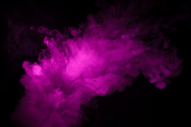 Colorful smoke close-up on a black background.