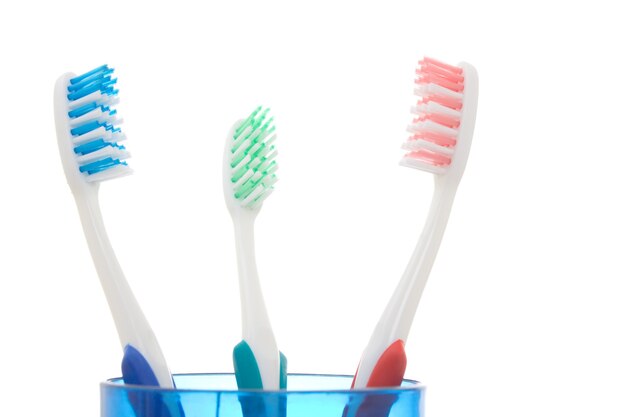 Colorful soft toothbrushes over white background