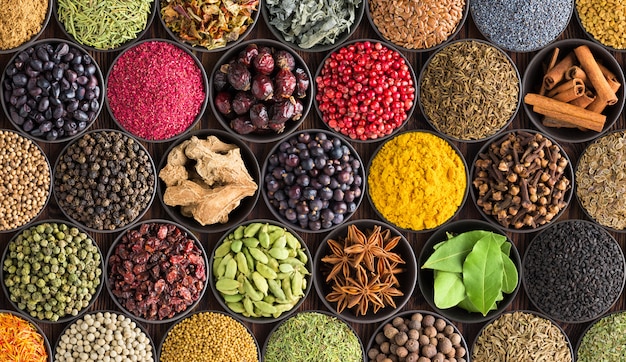 Colorful spice background, top view. Seasonings and herbs for Indian food