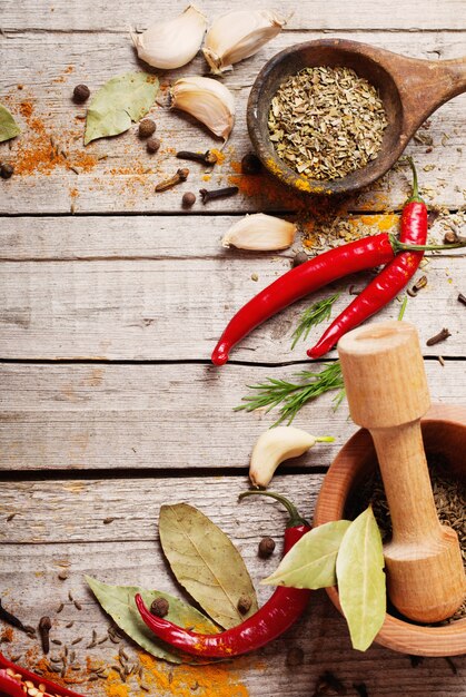 Colorful spices on a wooden background