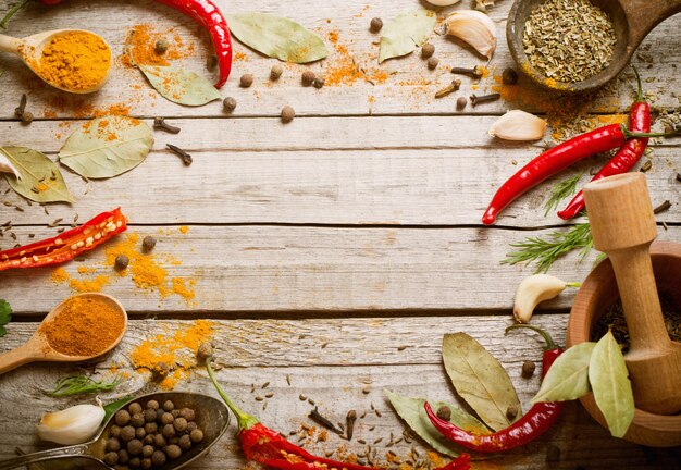 Colorful spices on a wooden background