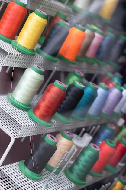 Colorful spools of thread on a rack