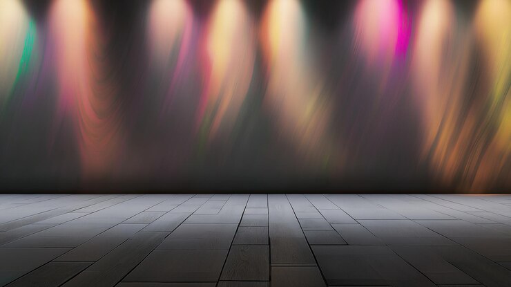 Colorful stage lights cast vibrant patterns on wooden floor for event decoration