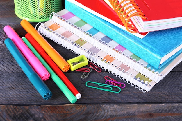 Photo colorful stationery on wooden table closeup