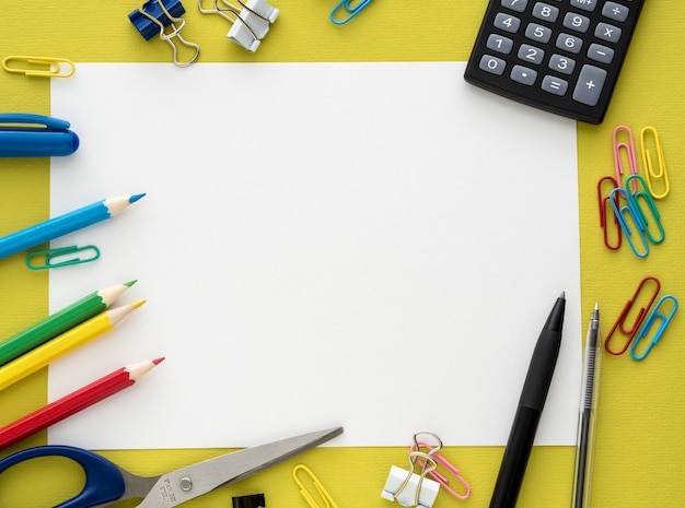 Colorful stationery on yellow background