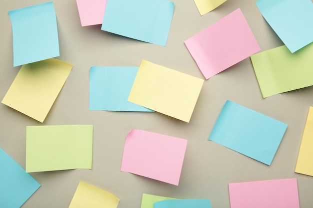 Colorful sticky notes on grey background