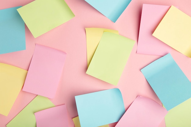 Colorful sticky notes on pink background Space for text