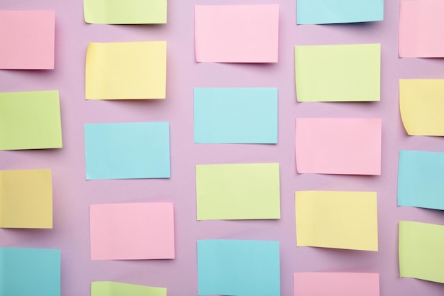 Colorful sticky notes on purple background