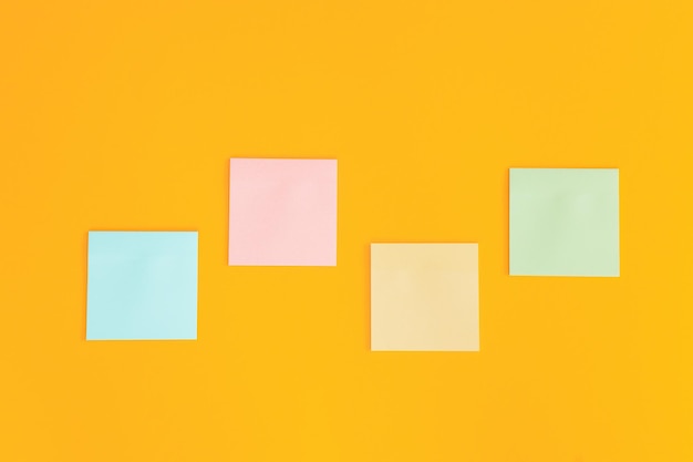 Colorful sticky notes on yellow background