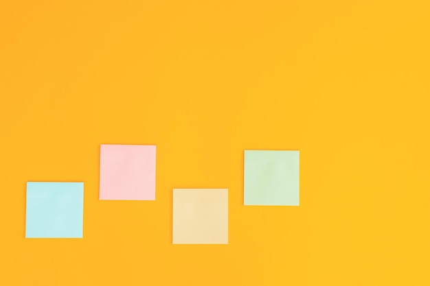 Colorful sticky notes on yellow background