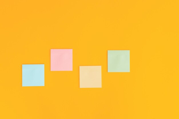 Colorful sticky notes on yellow background