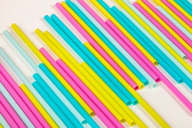 Colorful straws for beverage soft drink on colored 