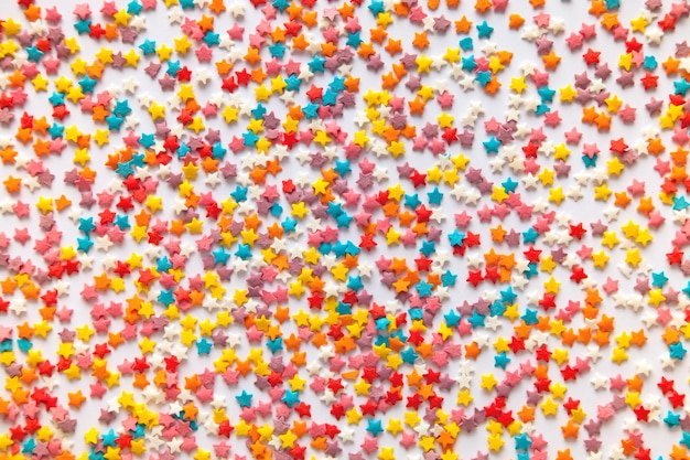 Photo colorful sugar star sprinkles background