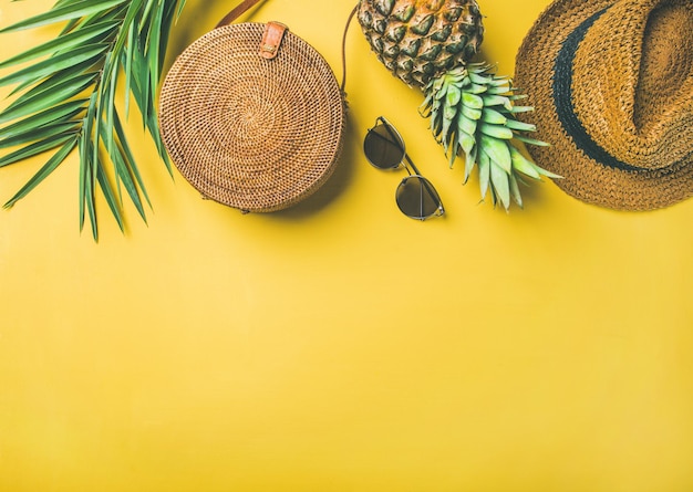 Colorful summer female fashion outfit over yellow background